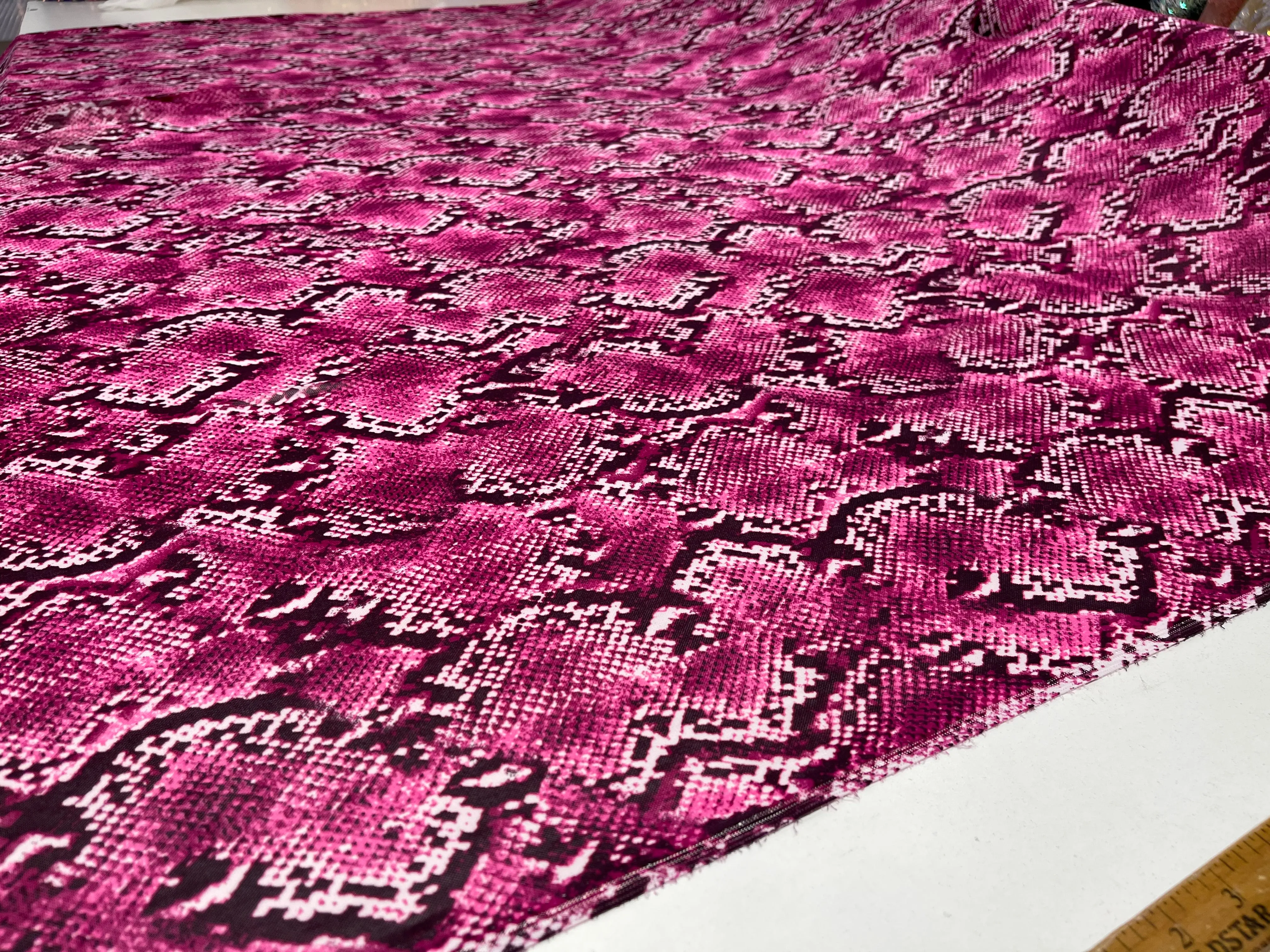 Fuchsia/ Black snake design on a power mesh 4-way stretch 58"-Sold by the yard.