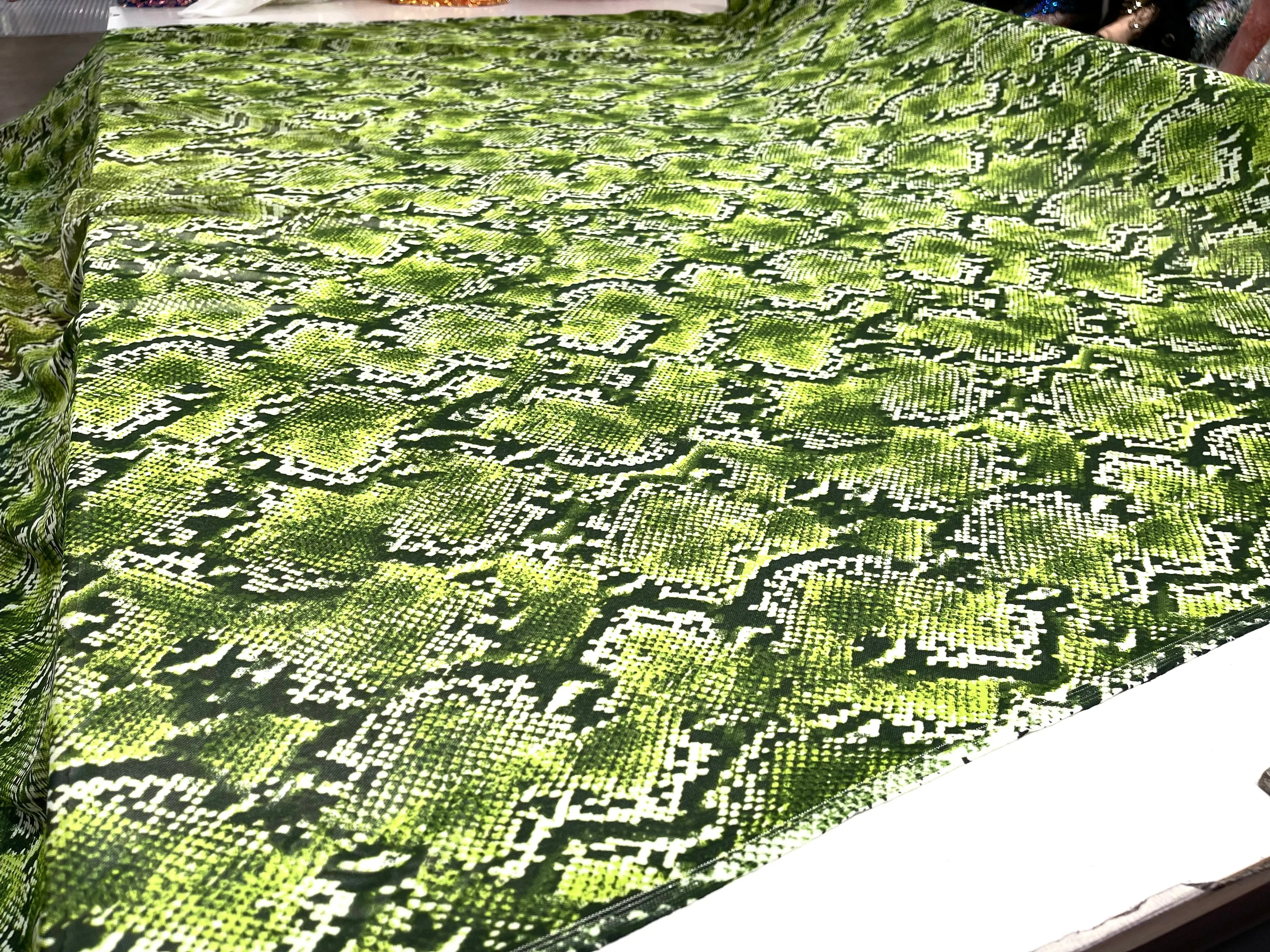 Green/ Black snake design on a power mesh 4-way stretch 58"-Sold by the yard.